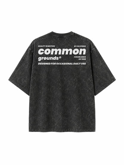 Black acid wash tee “Quality in Motion” by CG STUDIO